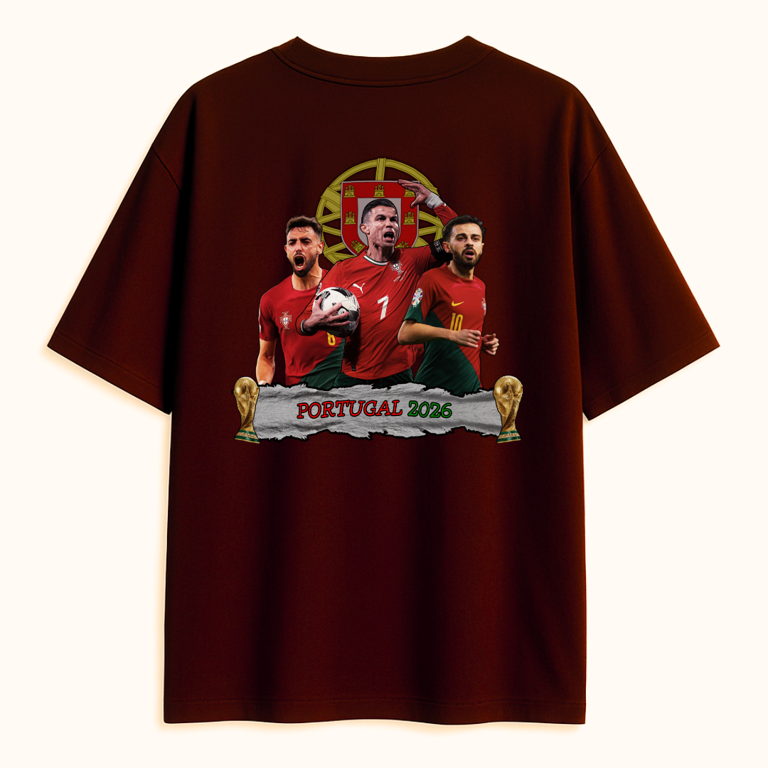 A Maroon T-shirt featuring an illustrated design of three Portuguese football players in red jerseys, a football, two trophy icons, and the text ‘Portugal 2026’ on the back.