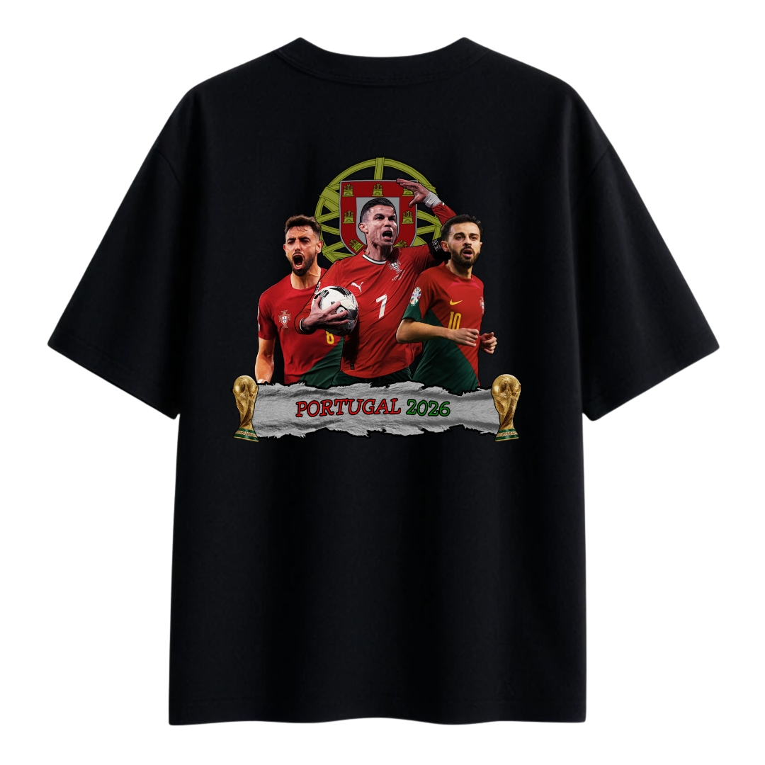 A Black T-shirt featuring an illustrated design of three Portuguese football players in red jerseys, a football, two trophy icons, and the text ‘Portugal 2026’ on the back.