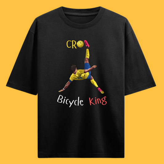 Black t-shirt with a graphic of Ronaldo doing a bicycle kick and text on a beige background that says 'Bicycle King'
