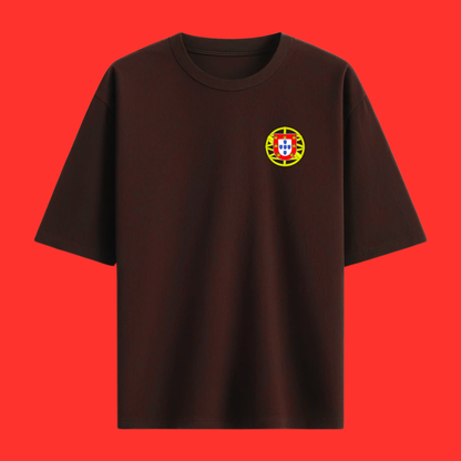 Maroon t-shirt with a small portugal emblem on the chest on a white background