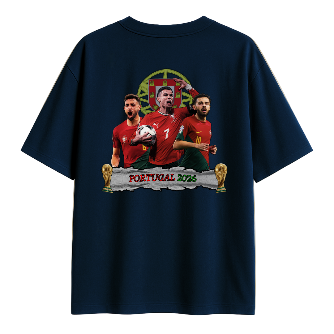 A Navy Blue T-shirt featuring an illustrated design of three Portuguese football players in red jerseys, a football, two trophy icons, and the text ‘Portugal 2026’ on the back.